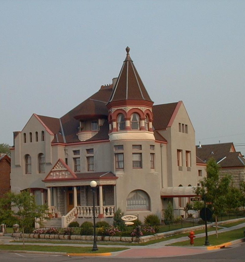 Victorian-style mansion with turreted roof