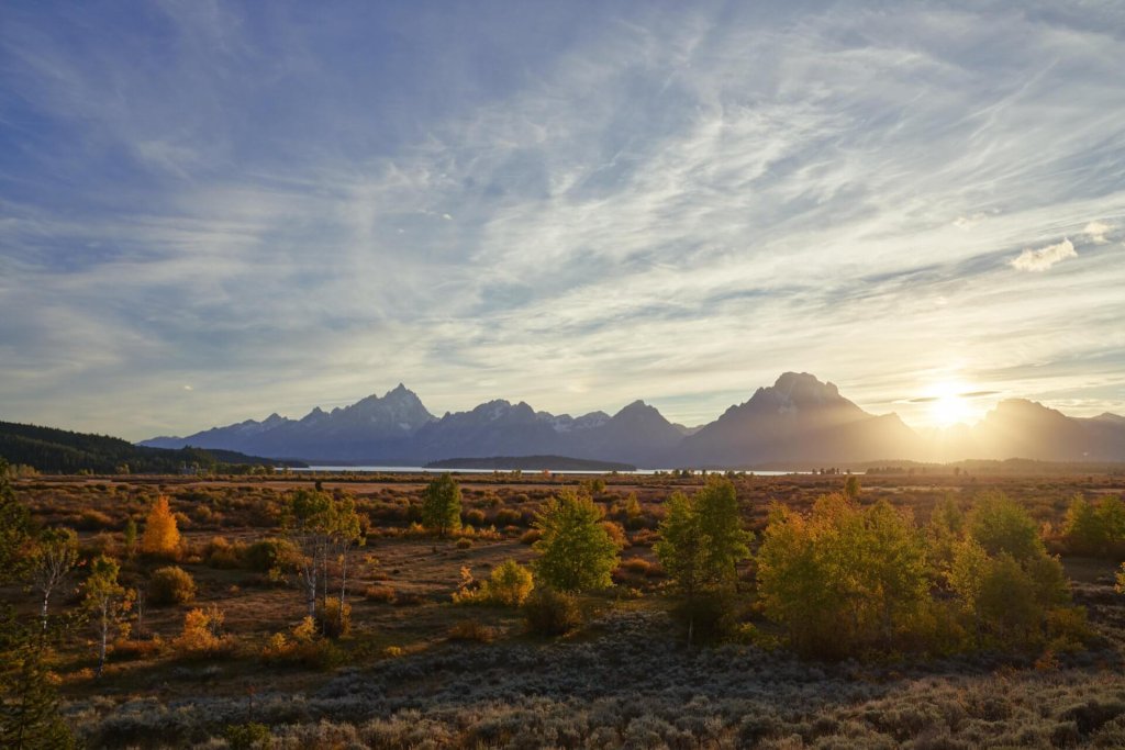 Uncovering Hidden Histories: Lesser-Known Stories from Wyoming’s Early Days 9 Majestic wyoming mountains under a colorful sky.